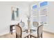 Dining room with modern lighting, and ample natural light at 14174 Thoroughbred Dr, Dade City, FL 33525