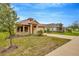 Attractive one-story home with manicured lawn, simple landscaping, and modern design at 14174 Thoroughbred Dr, Dade City, FL 33525