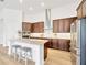 Kitchen with an island, stainless steel appliances and wooden cabinets at 14174 Thoroughbred Dr, Dade City, FL 33525
