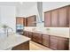 Modern kitchen with stainless steel appliances and granite countertops at 14174 Thoroughbred Dr, Dade City, FL 33525
