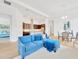 Open-concept living space showcasing the kitchen, dining area, and comfortable lounge with bright, natural lighting at 14174 Thoroughbred Dr, Dade City, FL 33525