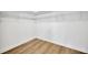 Spacious walk-in closet with built in metal shelving and wood flooring at 14174 Thoroughbred Dr, Dade City, FL 33525