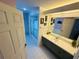 Spacious bathroom featuring a large mirror, vanity, shower, and access to the toilet at 14334 Teasdale Ave, Hudson, FL 34667