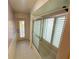 Bathroom featuring a shower with plantation shutters, offering natural light and privacy at 14334 Teasdale Ave, Hudson, FL 34667