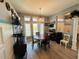 Charming dining area with decorative chandelier, classic furniture and lots of natural light at 14334 Teasdale Ave, Hudson, FL 34667