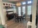 Charming dining area with decorative chandelier, classic furniture and lots of natural light at 14334 Teasdale Ave, Hudson, FL 34667