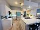 Bright kitchen with modern appliances, lots of counter space, and a breakfast bar at 14334 Teasdale Ave, Hudson, FL 34667
