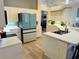 Bright kitchen with modern appliances, lots of counter space, and a breakfast bar at 14334 Teasdale Ave, Hudson, FL 34667
