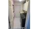 Functional laundry room with modern washer and dryer, storage cabinets, and easy access at 14334 Teasdale Ave, Hudson, FL 34667