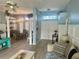 Open-concept living room with hardwood floors and lots of natural light at 14334 Teasdale Ave, Hudson, FL 34667