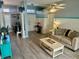 Open-concept living room with hardwood floors and lots of natural light at 14334 Teasdale Ave, Hudson, FL 34667