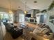 Spacious living room features a fireplace, ceiling fan, and sliding doors that offer ample natural light at 14334 Teasdale Ave, Hudson, FL 34667