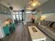 Open-concept living room with hardwood floors and lots of natural light at 14334 Teasdale Ave, Hudson, FL 34667