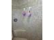 Close up on tiled shower with a built-in seat and mounted shower head at 14334 Teasdale Ave, Hudson, FL 34667