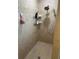 Shower featuring tiled walls and installed shelves for storage of your bath and shower needs at 14334 Teasdale Ave, Hudson, FL 34667