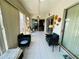 Bright sunroom with tile floor, ceiling fans and multiple sliding glass doors offering lots of light at 14334 Teasdale Ave, Hudson, FL 34667