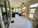 Bright sunroom with tile floor, ceiling fans and multiple sliding glass doors offering lots of light at 14334 Teasdale Ave, Hudson, FL 34667