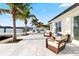 This backyard offers an inviting space with an outdoor seating area, pool, and access to waterfront activities with boat dock at 1493 Sea Gull S Dr, St Petersburg, FL 33707