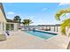 Modern pool with built-in seating and bay views, perfect for outdoor relaxation and entertainment at 1493 Sea Gull S Dr, St Petersburg, FL 33707