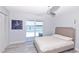Bedroom with a waterfront view and sliding door access to the pool at 1493 Sea Gull S Dr, St Petersburg, FL 33707