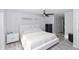 Modern bedroom with minimalist decor, ceiling fan, and sleek furniture at 1493 Sea Gull S Dr, St Petersburg, FL 33707