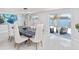 Dining area with stylish chairs, modern lighting, and expansive views of the waterfront at 1493 Sea Gull S Dr, St Petersburg, FL 33707