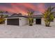 Modern home with sleek exterior, well-kept landscaping, double door entry, and extra large parking area at 1493 Sea Gull S Dr, St Petersburg, FL 33707