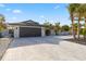 Beautiful home with an oversized garage, modern exterior, manicured landscaping, and large driveway at 1493 Sea Gull S Dr, St Petersburg, FL 33707