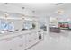 Open living area with modern cabinets and views of the canal at 1493 Sea Gull S Dr, St Petersburg, FL 33707