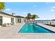 Backyard pool with dock and waterfront views, surrounded by lush landscaping at 1493 Sea Gull S Dr, St Petersburg, FL 33707