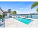 Pool area overlooking bay with dock and waterfront views at 1493 Sea Gull S Dr, St Petersburg, FL 33707