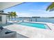 Waterfront pool deck features a pool with dock and gorgeous water views at 1493 Sea Gull S Dr, St Petersburg, FL 33707