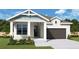 A rendered image of a charming one-story home featuring an attached garage, manicured front yard, and stylish architectural details at 1828 27Th N Ave, St Petersburg, FL 33713