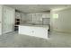 Unfinished kitchen with ample cabinet space and a large island at 1828 27Th N Ave, St Petersburg, FL 33713
