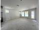 Bright living room with multiple windows and access to the outdoors at 1828 27Th N Ave, St Petersburg, FL 33713