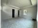 Spacious main bedroom with tray ceiling, doors to bathroom, and natural lighting at 1828 27Th N Ave, St Petersburg, FL 33713