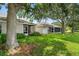Spacious backyard with lush lawn and mature trees providing shade and privacy at 19232 Barred Owl Ct, Land O Lakes, FL 34638