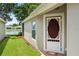 Inviting entryway with a decorative front door and well-maintained landscaping at 19232 Barred Owl Ct, Land O Lakes, FL 34638