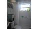 Clean bathroom with a shower and tub combination and a bright window view at 1991 63Rd N Ave, St Petersburg, FL 33702