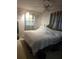 A bedroom featuring unique wall decor, soft lighting, and a cozy, inviting atmosphere at 1991 63Rd N Ave, St Petersburg, FL 33702