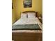 Cozy bedroom featuring a comfortable bed, matching pillows, and warm, inviting decor at 1991 63Rd N Ave, St Petersburg, FL 33702