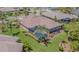 Aerial view of home featuring screened-in pool and well-maintained backyard at 20142 Lace Cascade Rd, Land O Lakes, FL 34637