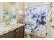 Bathroom featuring a vanity, mirror, and a shower with a floral curtain at 20142 Lace Cascade Rd, Land O Lakes, FL 34637