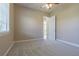 Empty bedroom features light neutral colors, carpet, and a window with natural light at 20142 Lace Cascade Rd, Land O Lakes, FL 34637