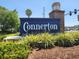 Community sign for Connerton framed by colorful shrubs, plants and landscaping at 20142 Lace Cascade Rd, Land O Lakes, FL 34637