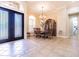 Dining room features a decorative china cabinet and modern chandelier at 20142 Lace Cascade Rd, Land O Lakes, FL 34637