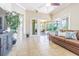 A spacious living room filled with natural light from sliding doors leading to the outdoor space at 20142 Lace Cascade Rd, Land O Lakes, FL 34637