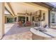 Inviting patio with a built-in kitchen and fire pit, perfect for entertaining guests at 20142 Lace Cascade Rd, Land O Lakes, FL 34637