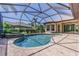 Sparkling pool with lush landscaping, perfect for outdoor relaxation and enjoyment at 20142 Lace Cascade Rd, Land O Lakes, FL 34637