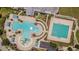 Community resort-style pool area with splashpad, lap pool, and plenty of space to relax in the Florida sunshine at 20142 Lace Cascade Rd, Land O Lakes, FL 34637